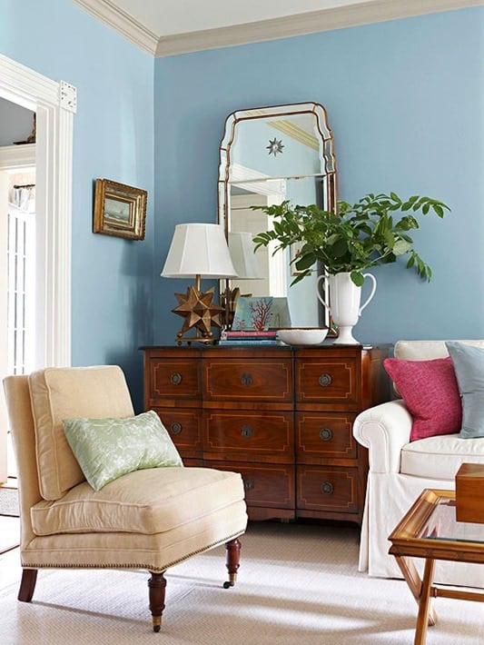 An Antique Chest Of Drawers In A Modern Living Room