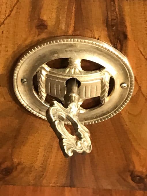 Biedermeier walnut dresser- detail of an escutcheon- styylish