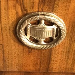 Biedermeier walnut dresser- detail of a brass fitting- styylish