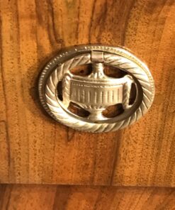 Biedermeier walnut dresser- detail of a brass fitting- styylish