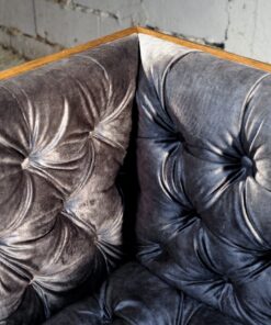 Reclaimed wood- detail of velvet upholstery of armchair- styylish