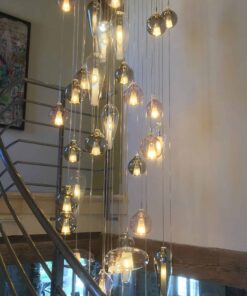 Hand blown glass pendant light-hanging in the staircase- Styylish