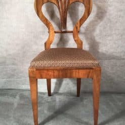 Six Biedermeier walnut chairs- one chair front view- styylish