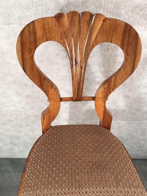 Six Biedermeier walnut chairs- one chair detail of the backrest- styylish