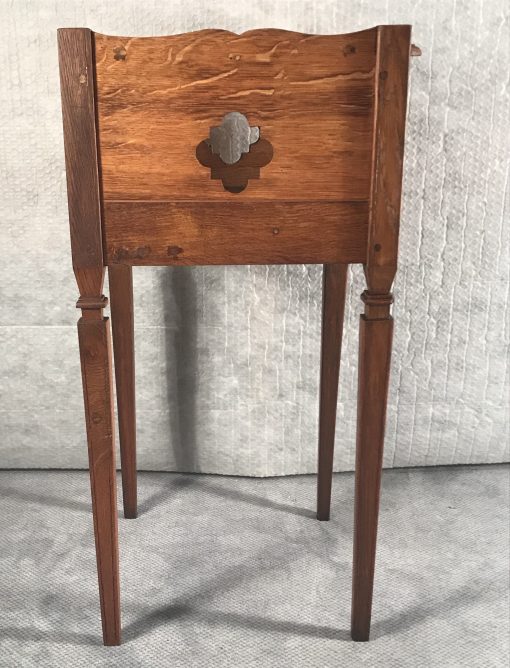 Two provincial nightstands- one of the two- side view with open work decor right- styylish