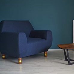 Upholstered Armchair- view of the blue covered armchair in a room- Styylish