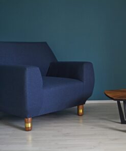 Upholstered Armchair- view of the blue covered armchair in a room- Styylish