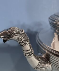 Silver coffee and tea set- detail of the spout of the tea pot- styylish