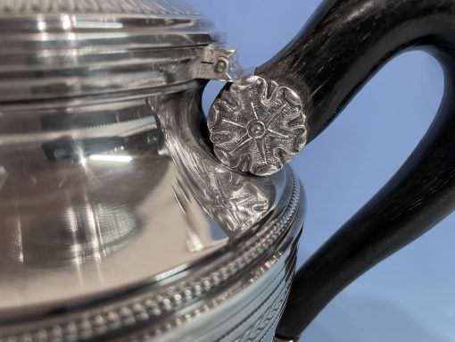 Silver coffee and tea set- detail of the repoussé flower decor- styylish