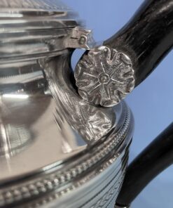 Silver coffee and tea set- detail of the repoussé flower decor- styylish