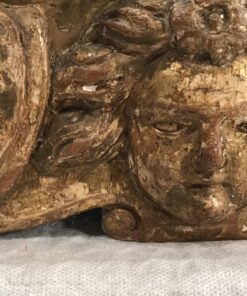 Baroque Gilt wood mirror- detail of the cherub head on the bottom- Styylish