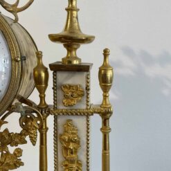 Louis XVI Mantel Clock- detail of the right side with white marble and ormolu- Styylish