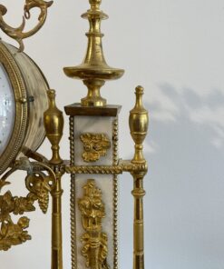 Louis XVI Mantel Clock- detail of the right side with white marble and ormolu- Styylish