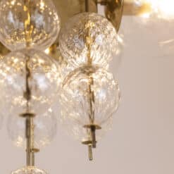 Brass and Glass Chandelier - Bulb with Lights On - Styylish