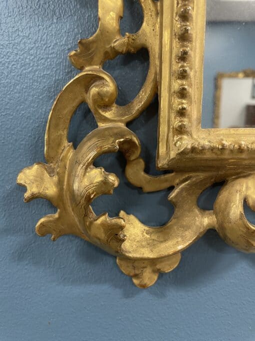 Hand-Carved Gilt Wood Mirror- detail of the lower left- Styylish