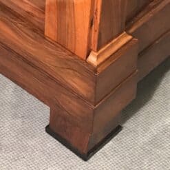 Biedermeier walnut armoire- corner view with foot- Styylish