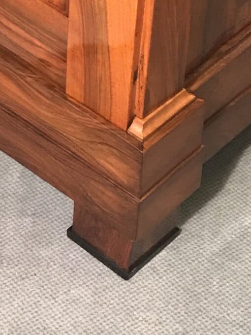 Biedermeier walnut armoire- corner view with foot- Styylish