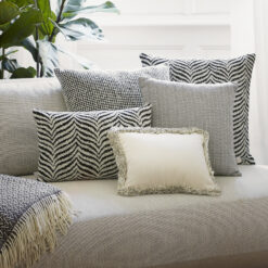 Zebra Black Cushion- combined with other cushions on a sofa- Styylish